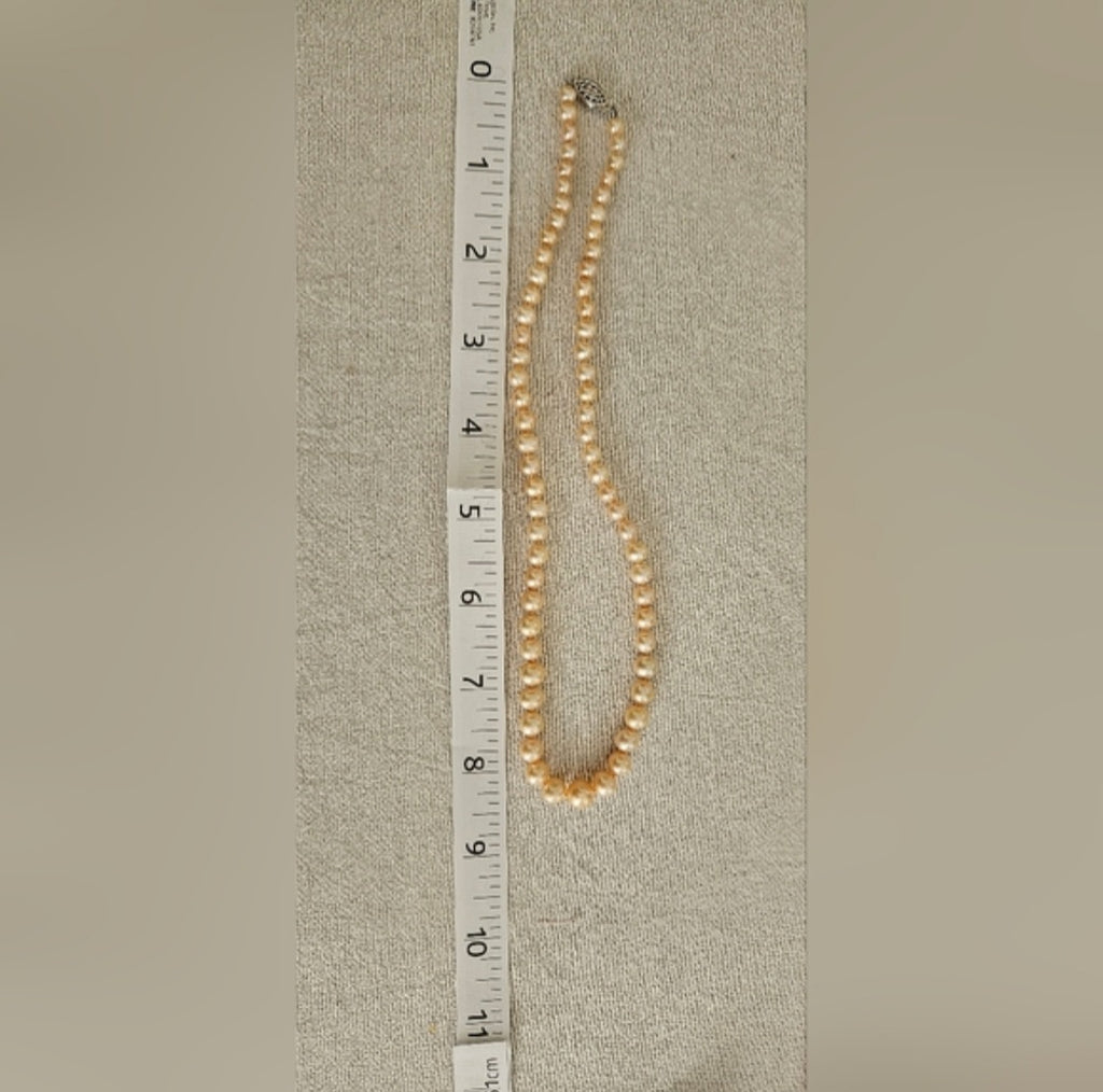 Graduated Cultured Peach Necklace. Peach color with Sterling Silver Clasp